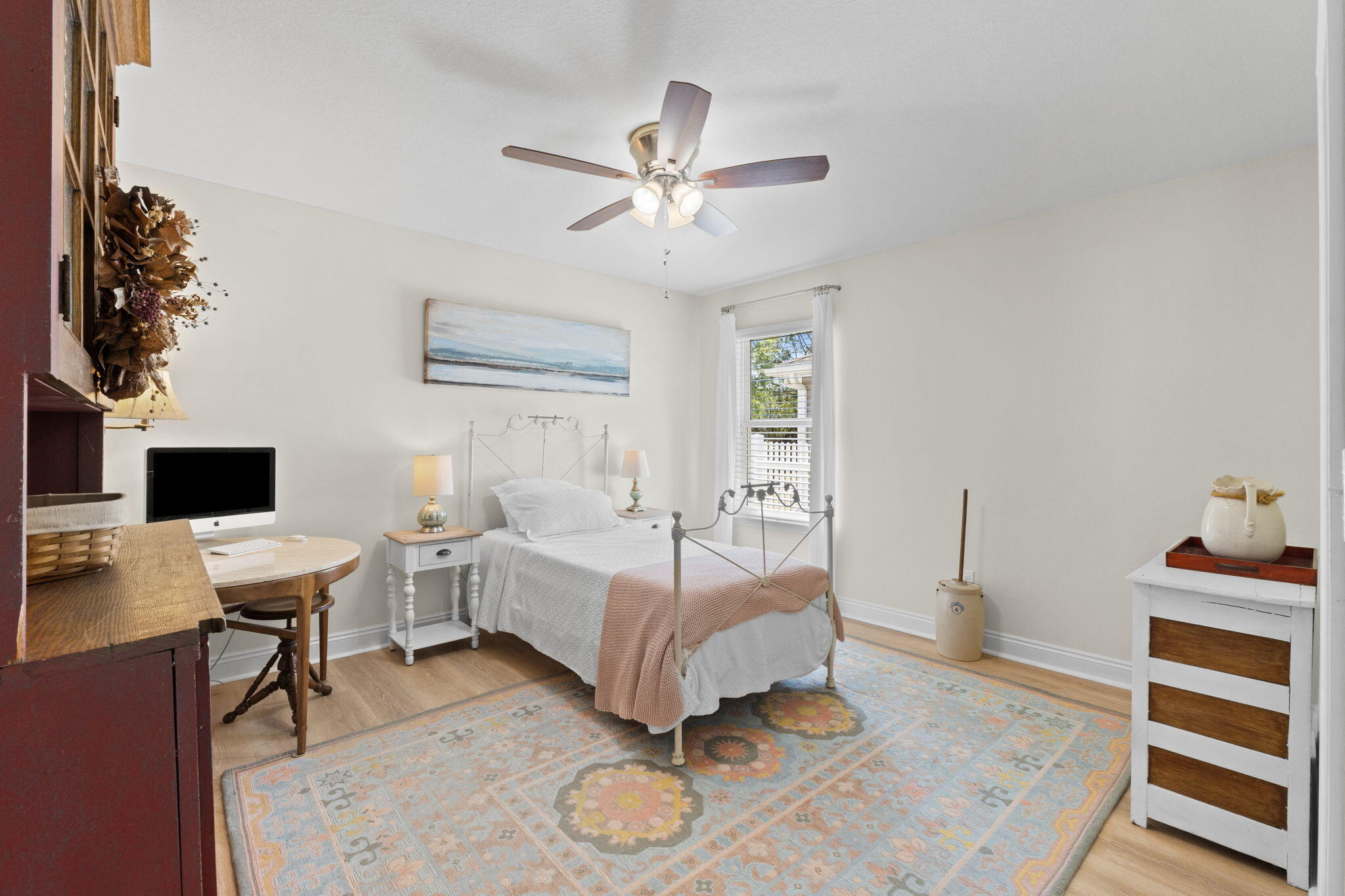 587 Fanny Ann Way Freeport, FL 32439 - Photo 36 of 78 a bedroom with a bed and a chandelier