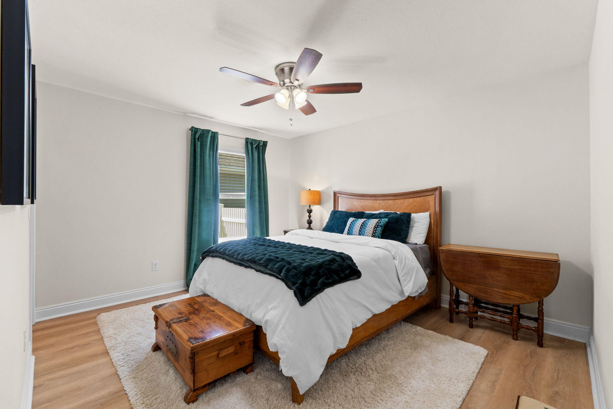 587 Fanny Ann Way Freeport, FL 32439 - Photo 42 of 78 a bedroom with a bed and wooden floor