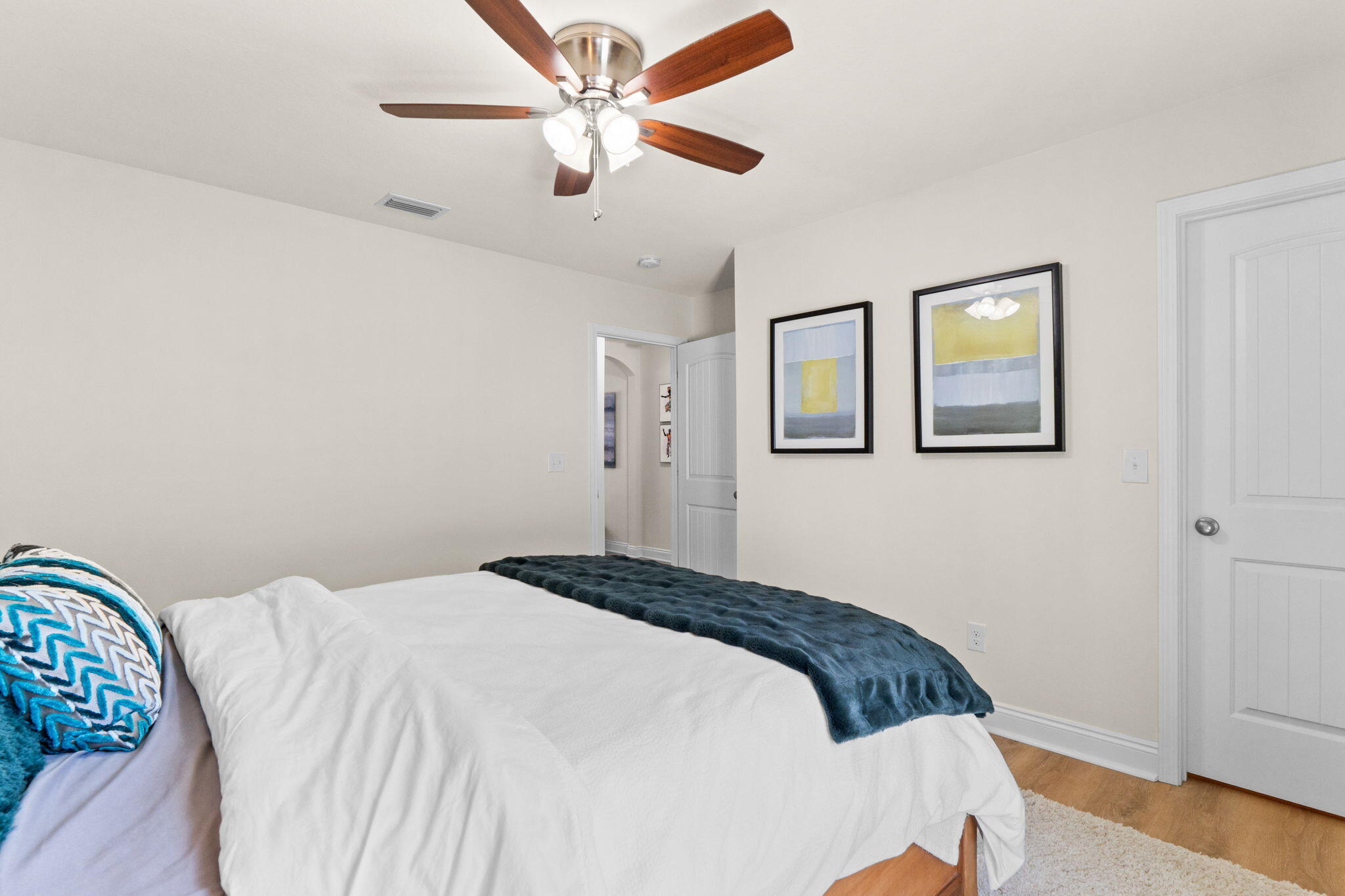 587 Fanny Ann Way Freeport, FL 32439 - Photo 44 of 78 a bedroom with a large bed and a ceiling fan