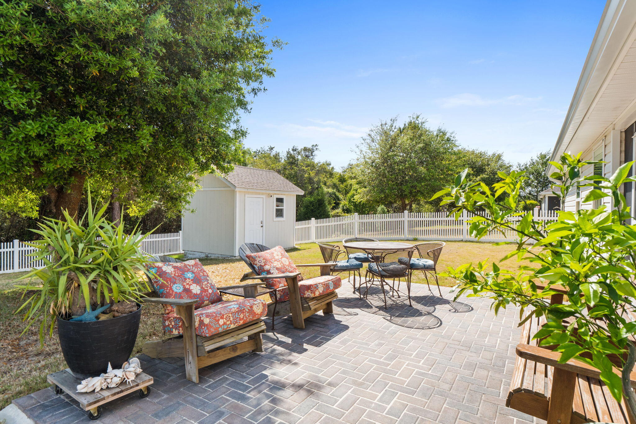 587 Fanny Ann Way Freeport, FL 32439 - Photo 47 of 78 a backyard of a house with table and chairs