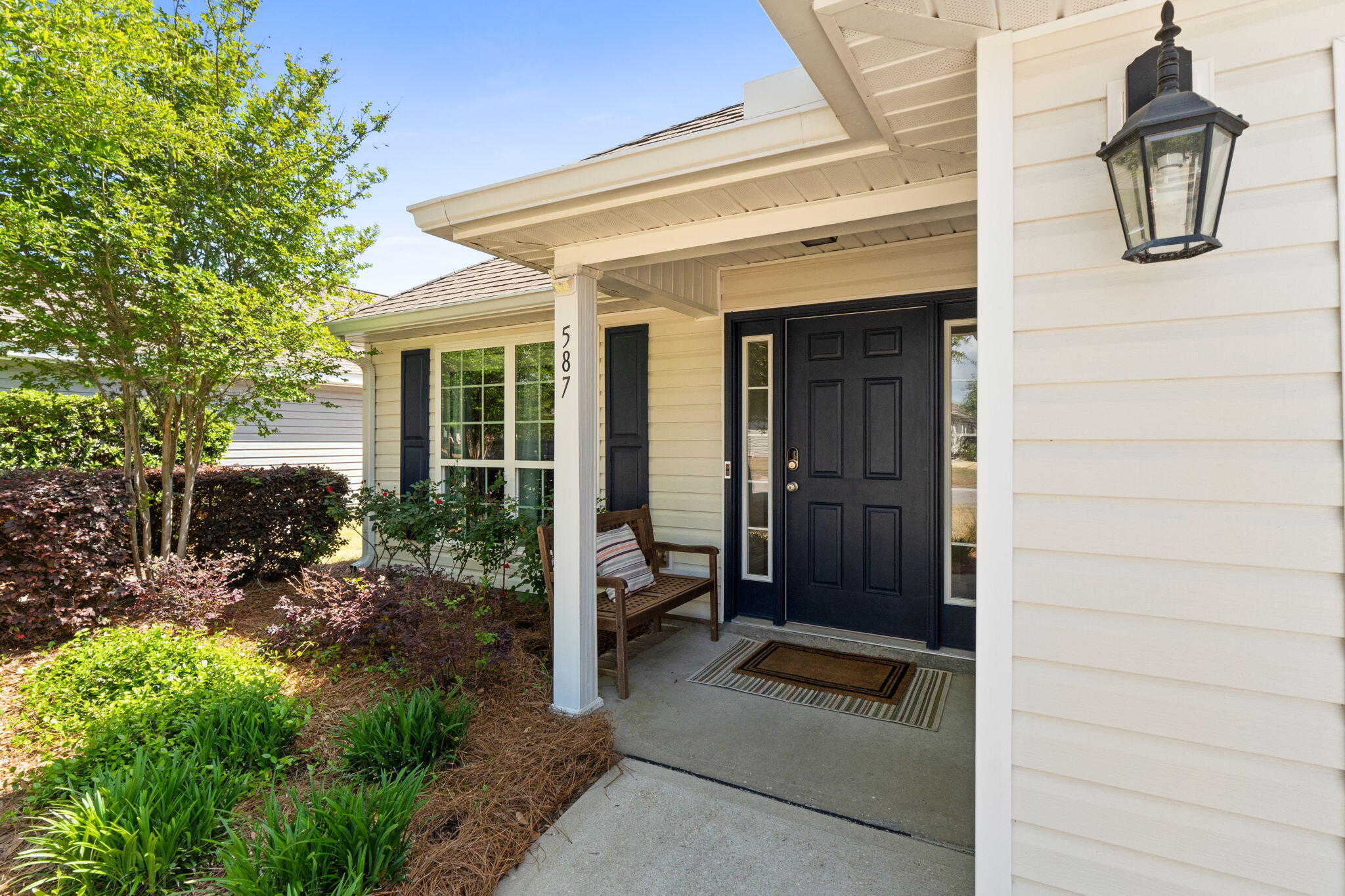 587 Fanny Ann Way Freeport, FL 32439 - Photo 59 of 78 a front view of a house with garden