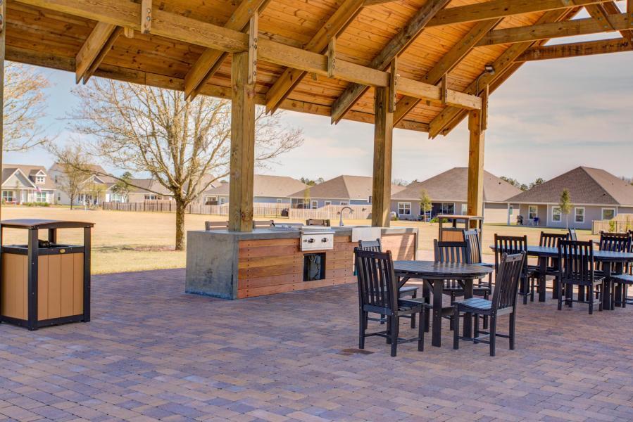 587 Fanny Ann Way Freeport, FL 32439 - Photo 61 of 78 a view of a patio with dining table and chairs