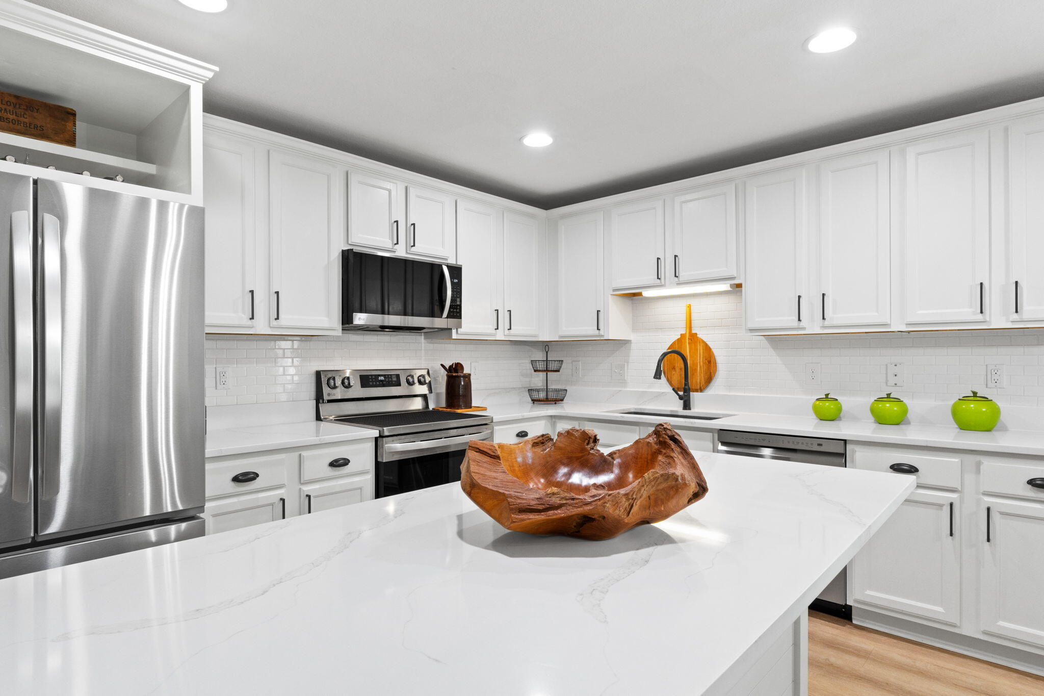 587 Fanny Ann Way Freeport, FL 32439 - Photo 7 of 78 a kitchen with stainless steel appliances a stove a sink a refrigerator a microwave and cabinets