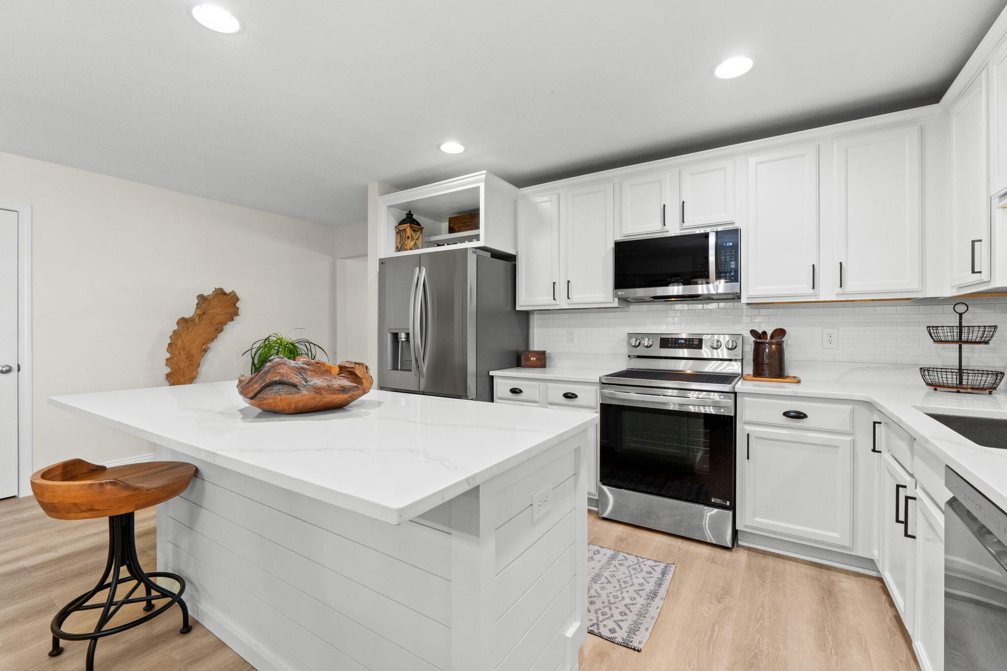 587 Fanny Ann Way Freeport, FL 32439 - Photo 10 of 78 a kitchen with stainless steel appliances a stove a sink and a refrigerator