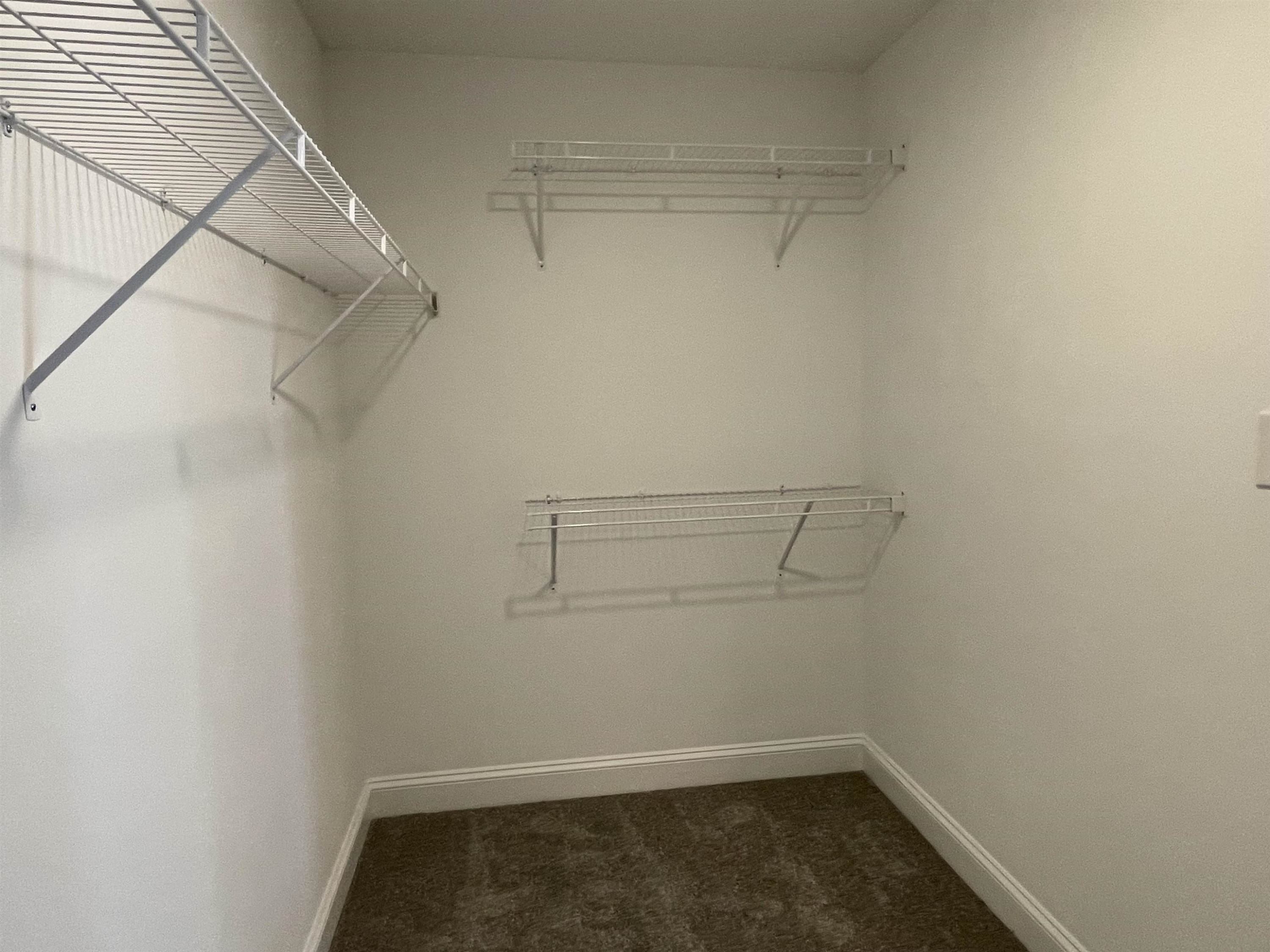 175 Devilwood Drive Four Oaks, NC 27524 - Photo 12 of 20 a view of a room with racks on the wall