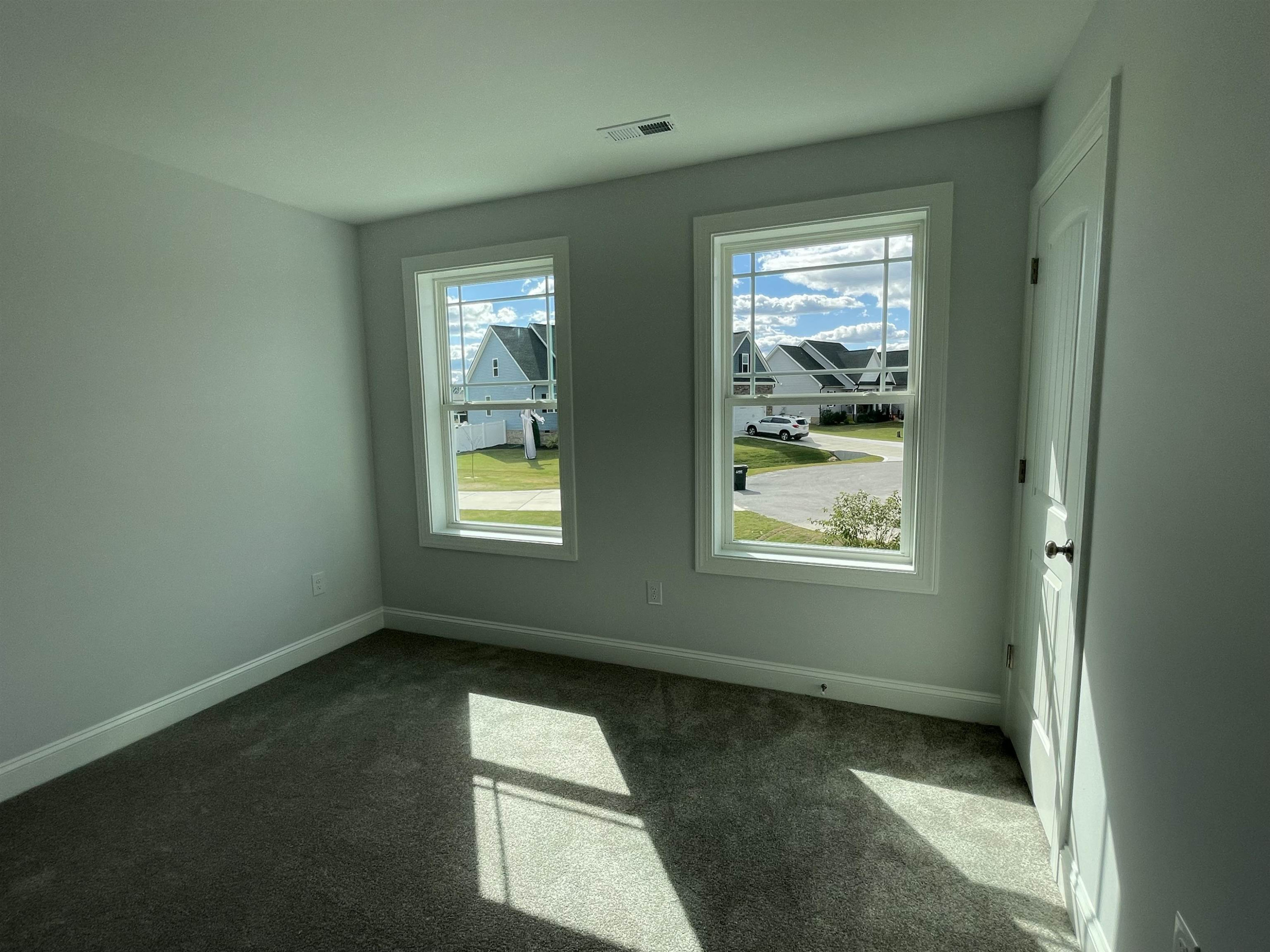 175 Devilwood Drive Four Oaks, NC 27524 - Photo 17 of 20 an empty room with windows