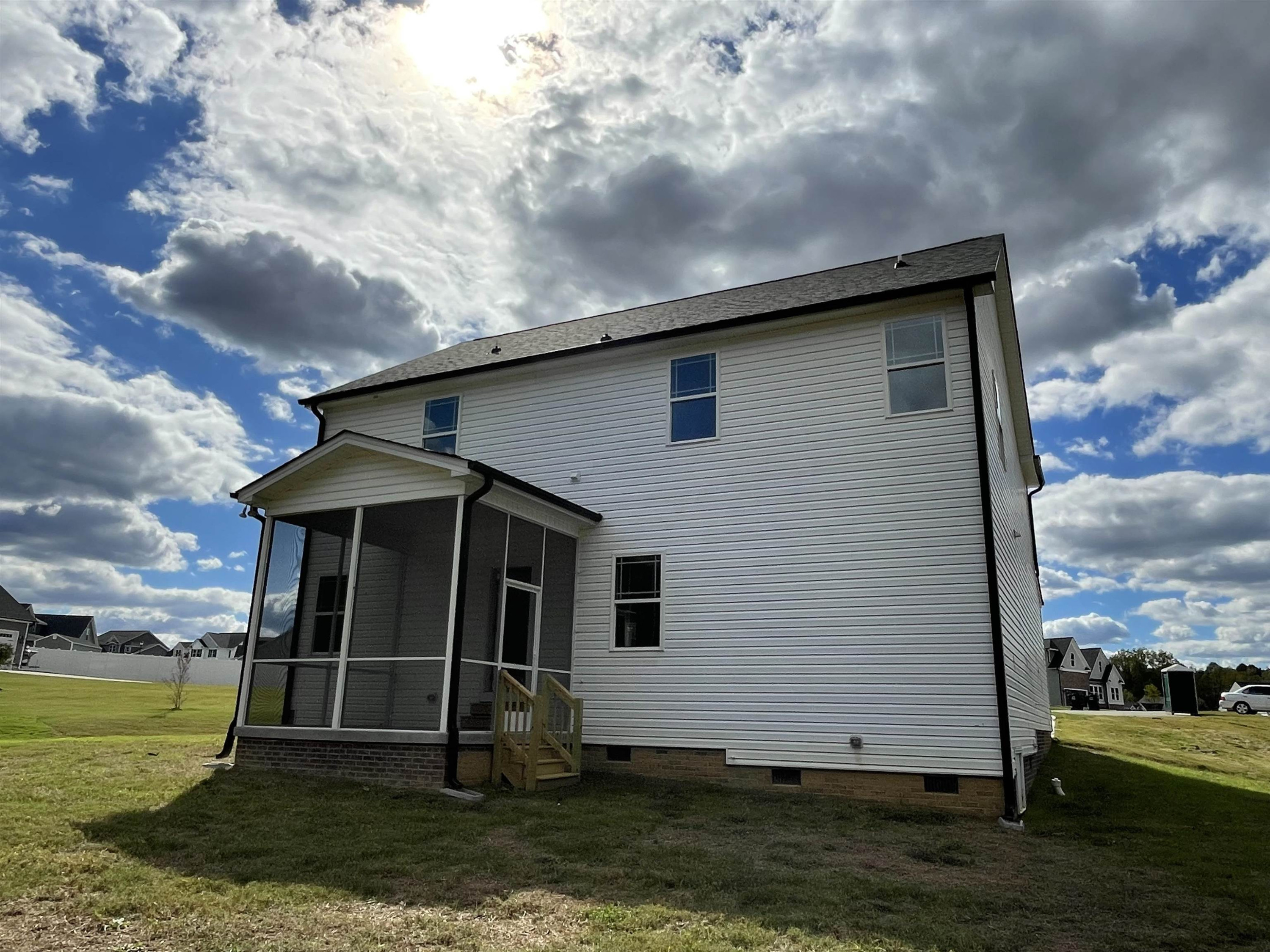 175 Devilwood Drive Four Oaks, NC 27524 - Photo 18 of 20 a front view of a house with a yard