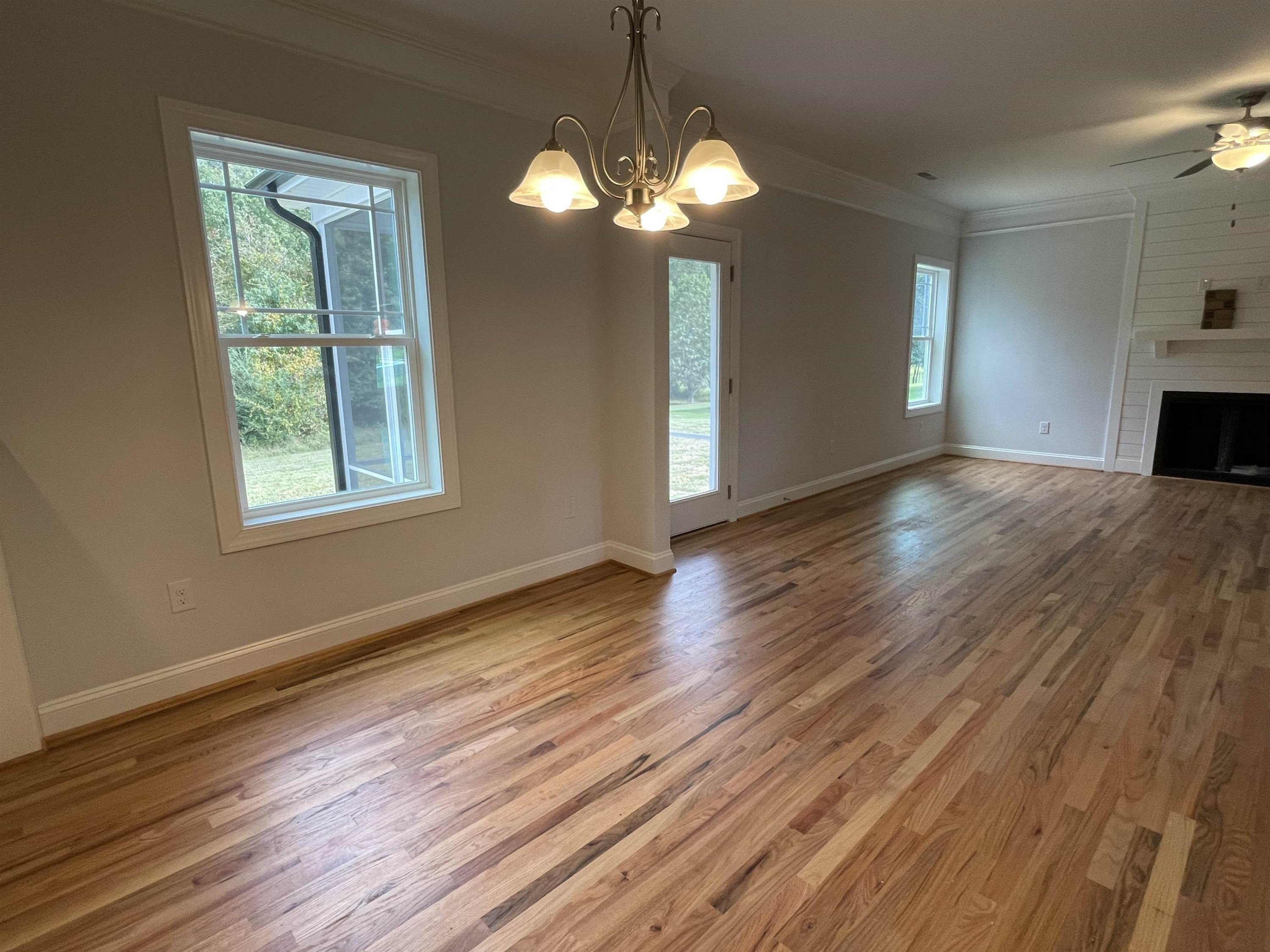 175 Devilwood Drive Four Oaks, NC 27524 - Photo 7 of 20 a view of livingroom with window and wooden floor