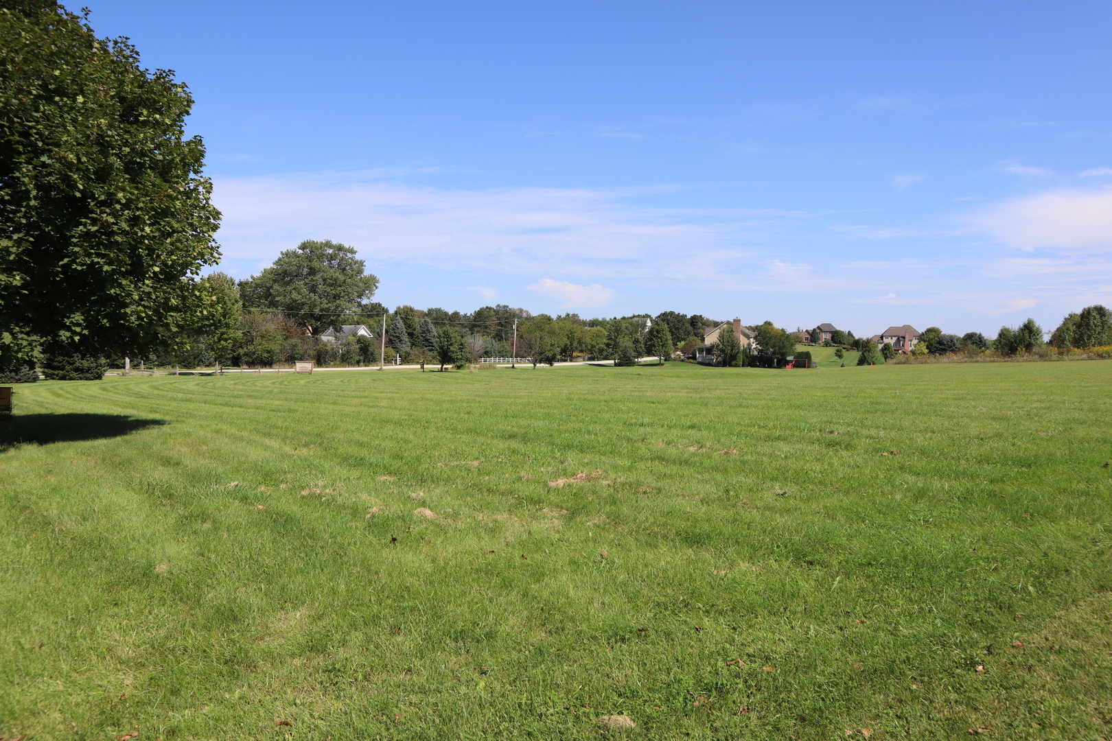 5-n475 Brown Road Wasco, IL 60175 - Photo 1 of 3 a view of a grassy field with trees in the background