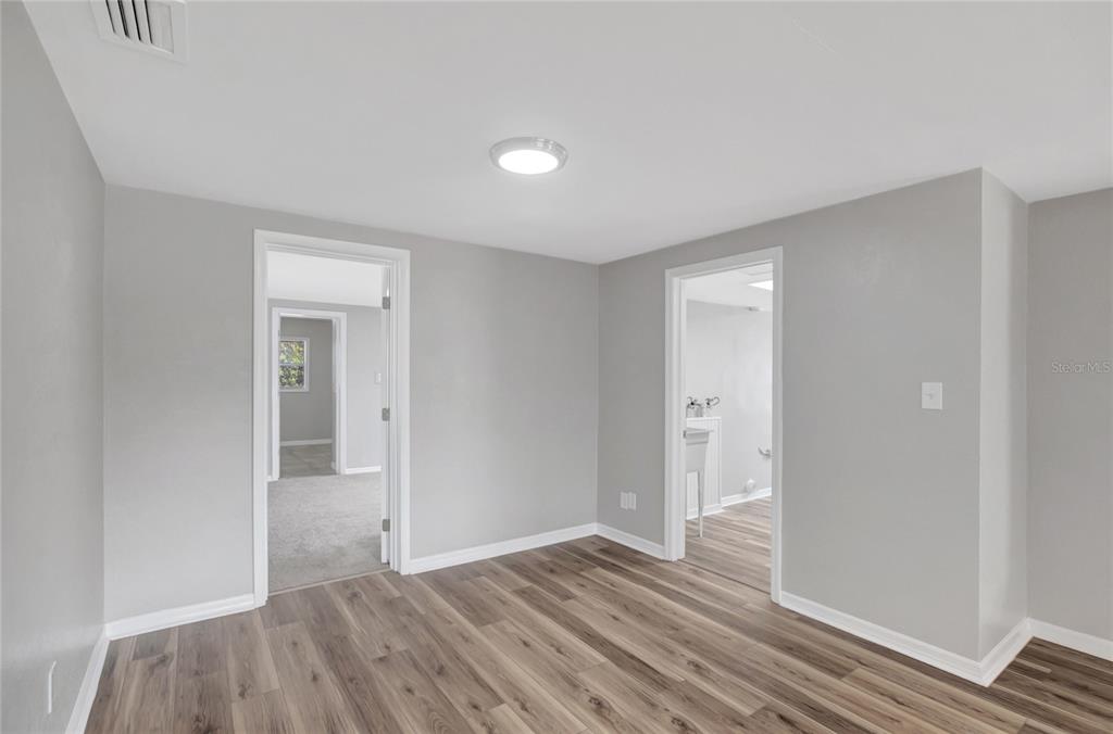 5605 Oceanic Road Holiday, FL 34690 - Photo 16 of 36 a view of wooden floor and windows in a room