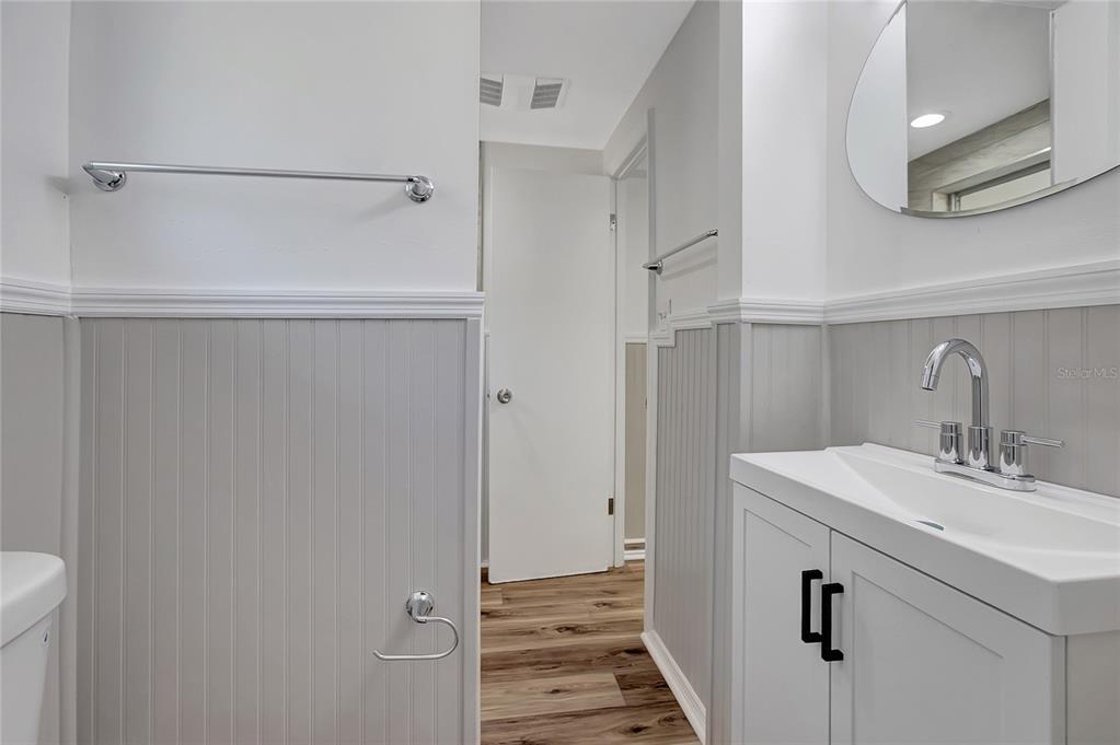 5605 Oceanic Road Holiday, FL 34690 - Photo 23 of 36 a bathroom with a sink and a mirror