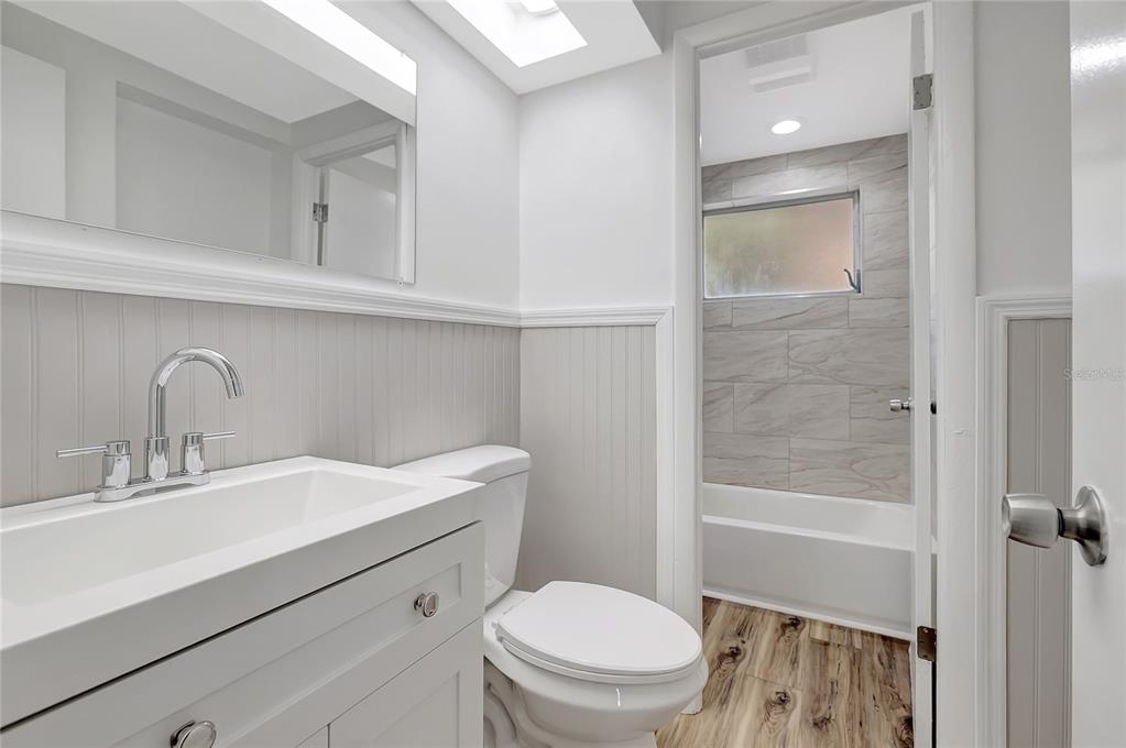 5605 Oceanic Road Holiday, FL 34690 - Photo 26 of 36 a bathroom with a sink a toilet and shower