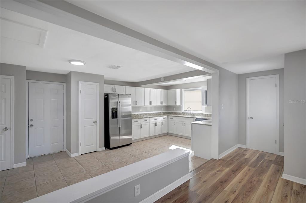 5605 Oceanic Road Holiday, FL 34690 - Photo 6 of 36 a kitchen with a refrigerator sink and stove top oven