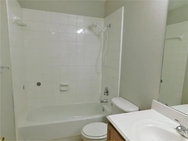 a bathroom with a sink toilet and bathtub