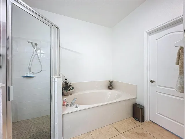 a bedroom with a bed and a desk