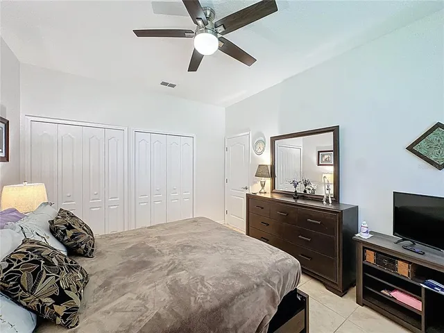 a bathroom with a shower sink vanity mirror and toilet