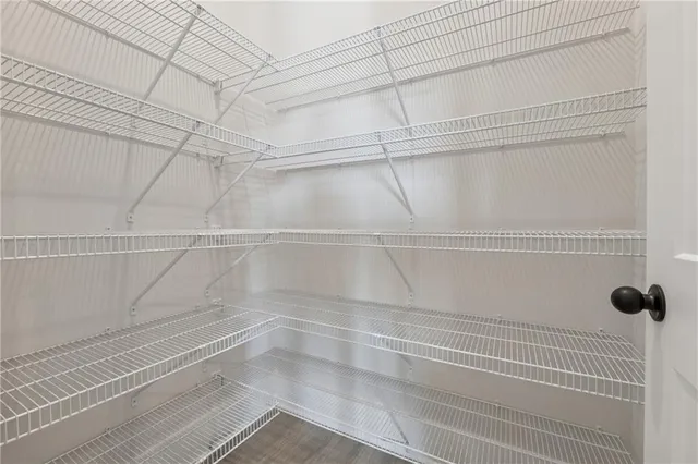 a view of a room with racks on the wall