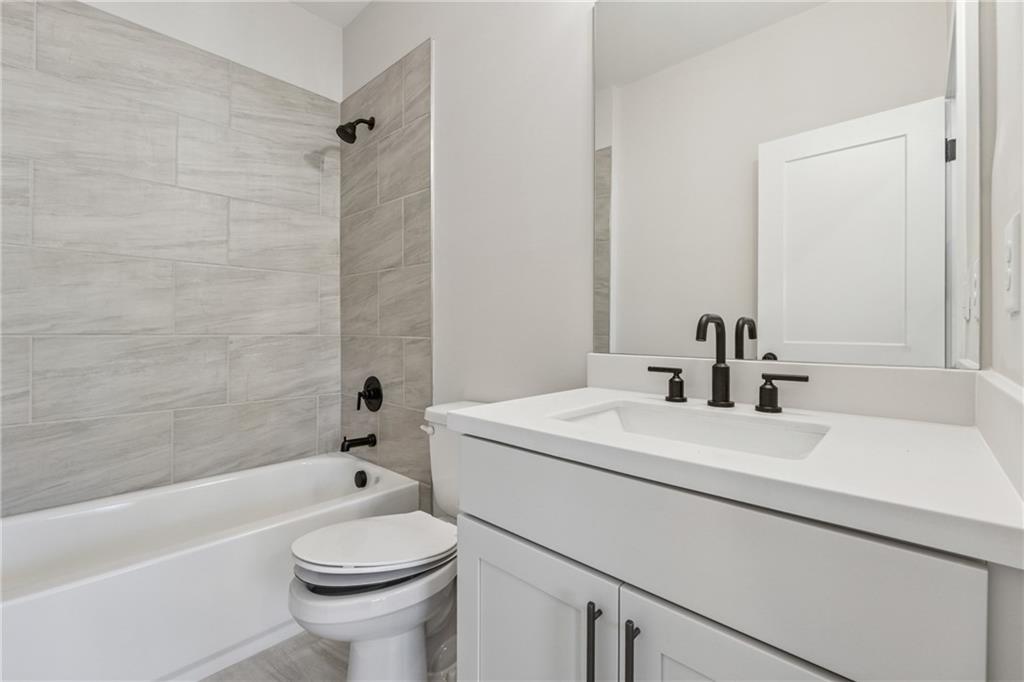 428 Mezzo Lane Alpharetta, GA 30009 - Photo 19 of 30 a bathroom with a sink a toilet and a bathtub