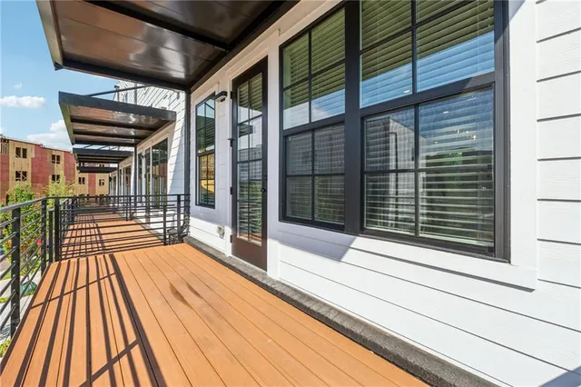 a view of backyard with a wooden deck