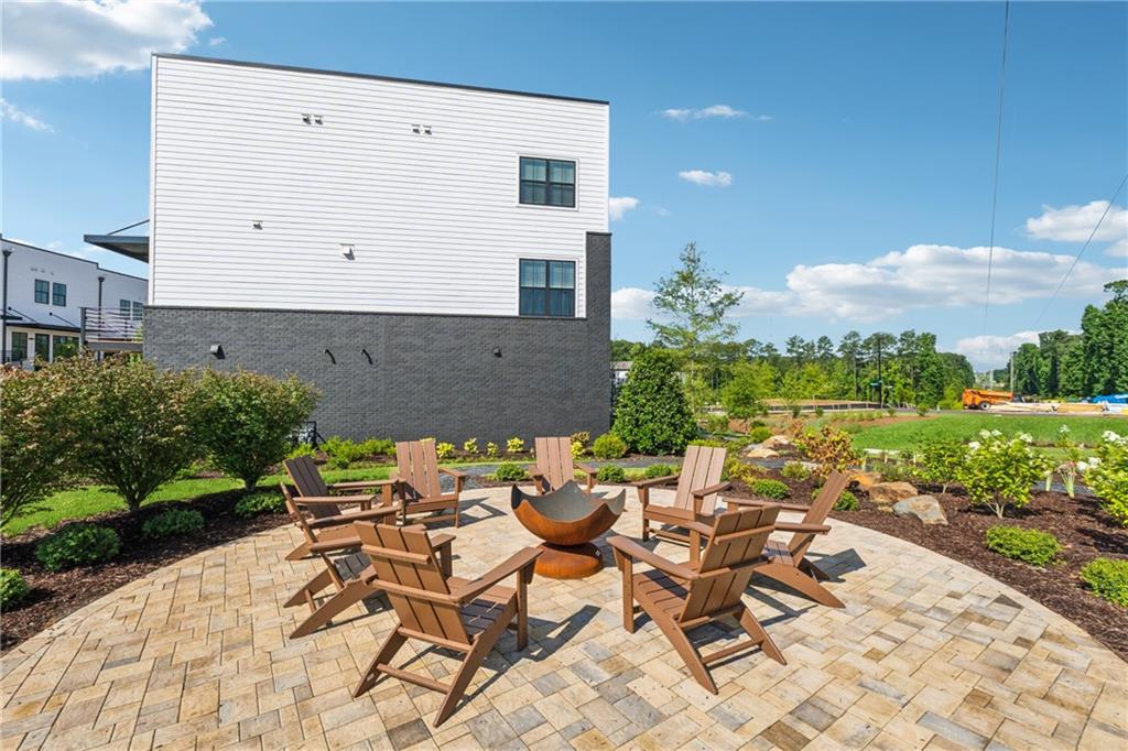 428 Mezzo Lane Alpharetta, GA 30009 - Photo 29 of 30 a view of a patio with table and chairs and potted plants