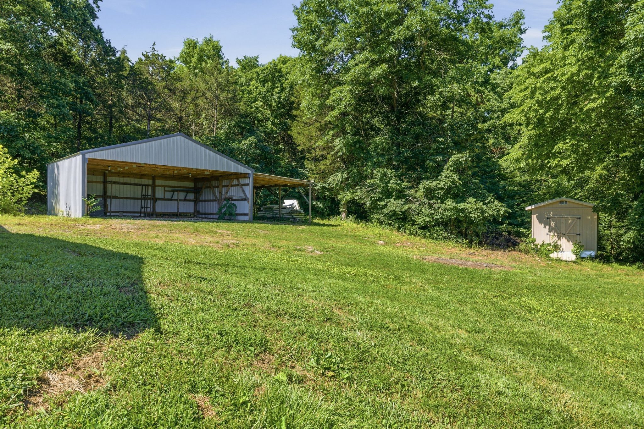 1021 B Jordan Road Lascassas, TN 37085 - Photo 55 of 58 a front view of a house with a yard