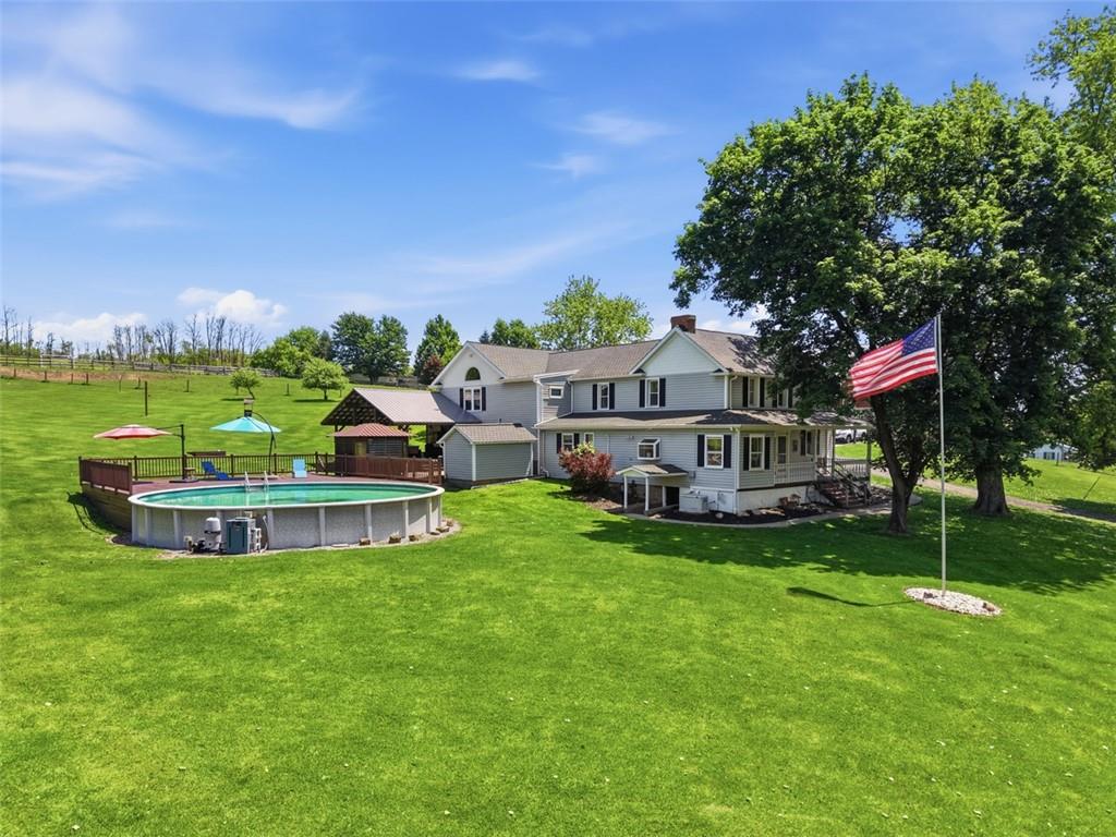 2976 Henderson Road Washington, PA 15301 - Photo 2 of 50 a view of a house with a big yard and large trees