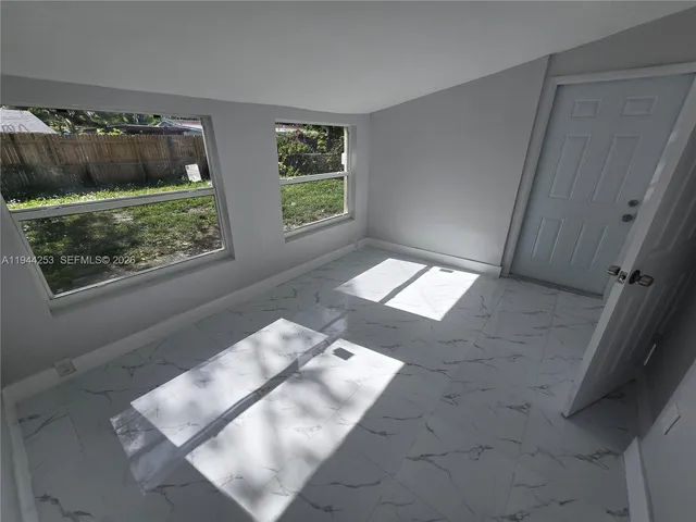 an empty room with windows