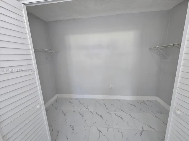 a view of an empty room and window