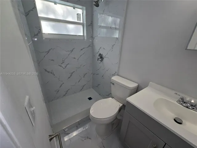 a view of a livingroom with wooden floor