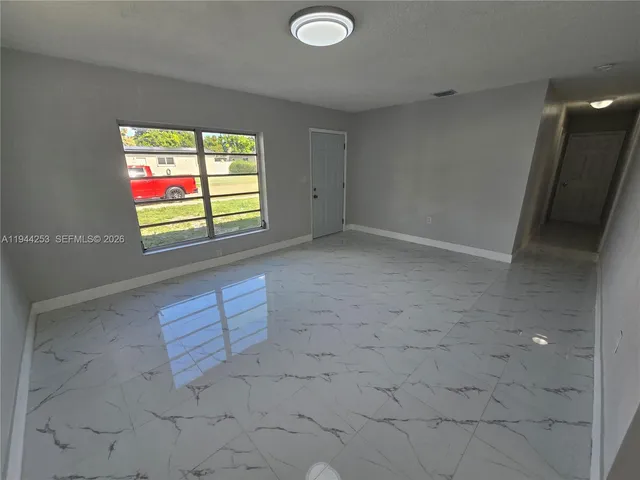 an empty room with windows