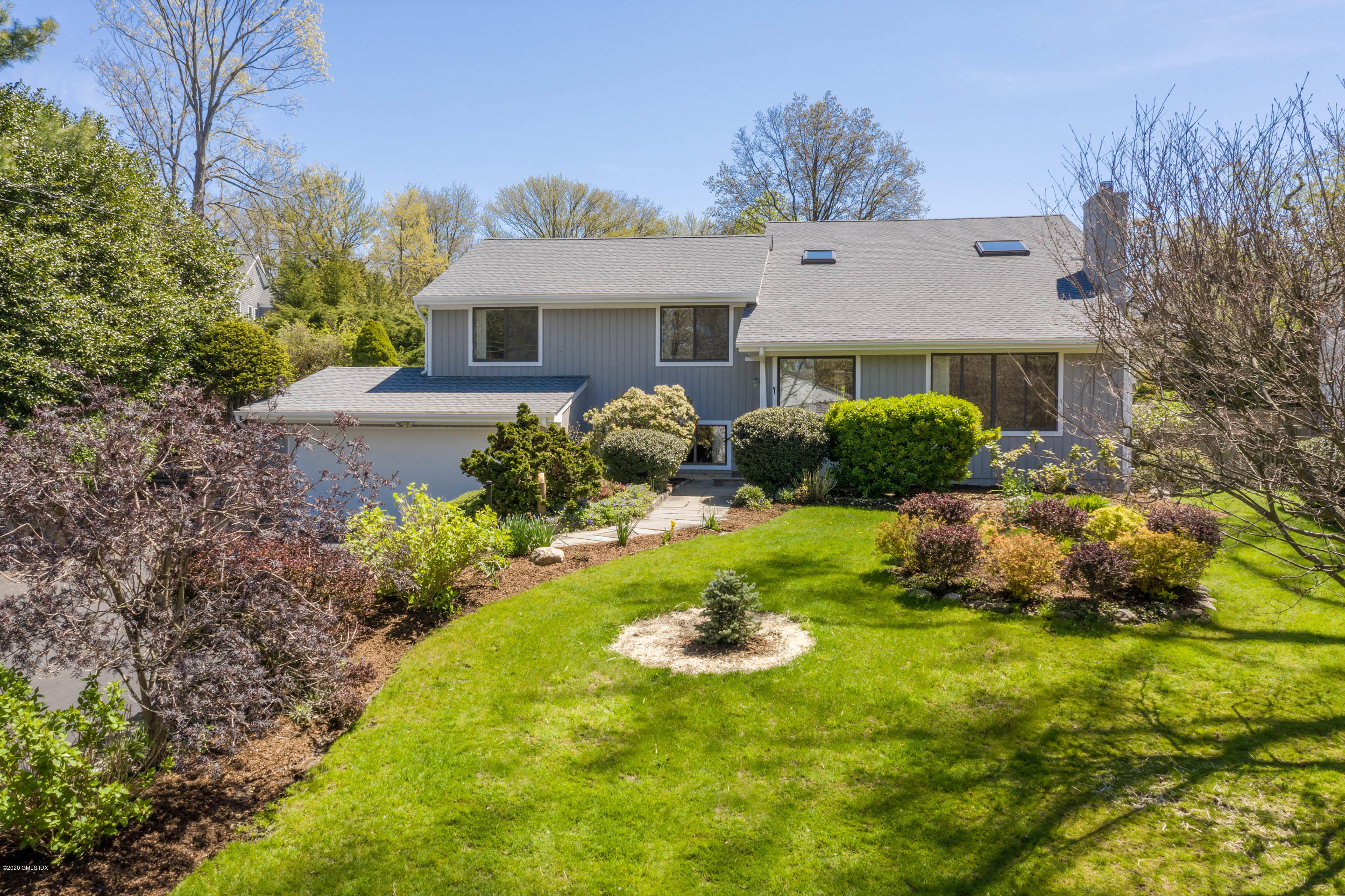 43 Druid Lane Riverside, CT 06878 - Photo 1 of 23 a front view of house with yard and green space