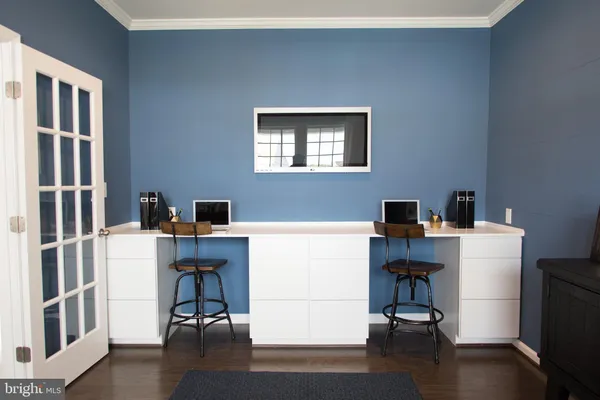 a workspace with furniture and wooden floor