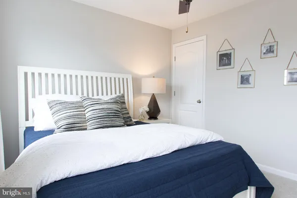 a bedroom with a bed and a couch