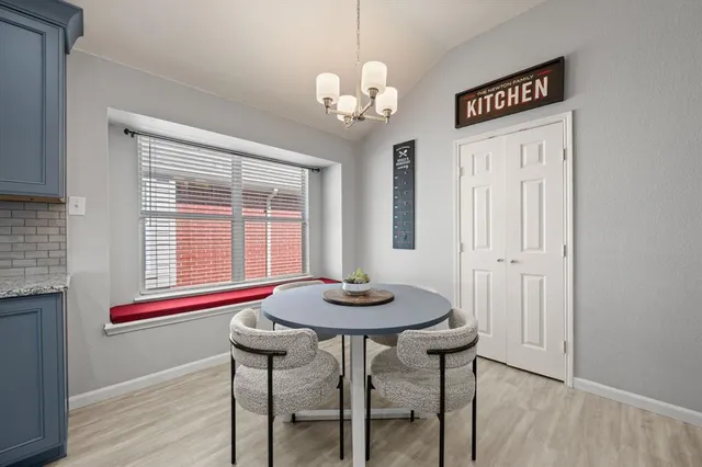 a dining room with furniture and window