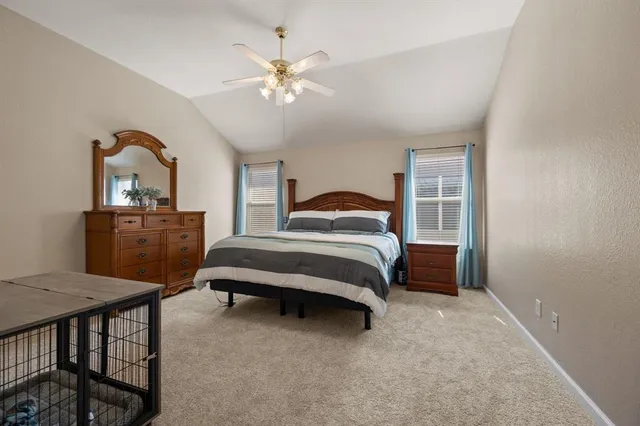 a bedroom with a bed and a table