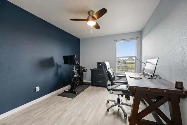 a view of a workspace with furniture