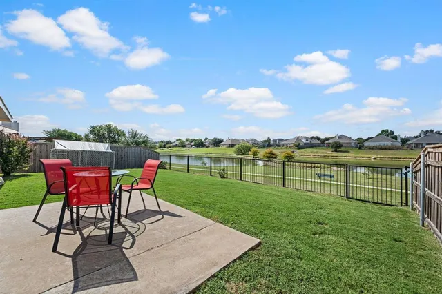 a view of a table and chairs in the garden