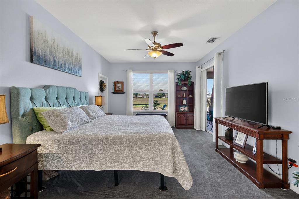 16288 Southwest 14th Avenue Road Ocala, FL 34473 - Photo 14 of 30 a living room with furniture and a flat screen tv