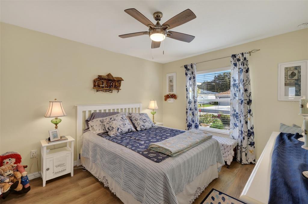 16288 Southwest 14th Avenue Road Ocala, FL 34473 - Photo 18 of 30 a bedroom with a bed and wooden floor