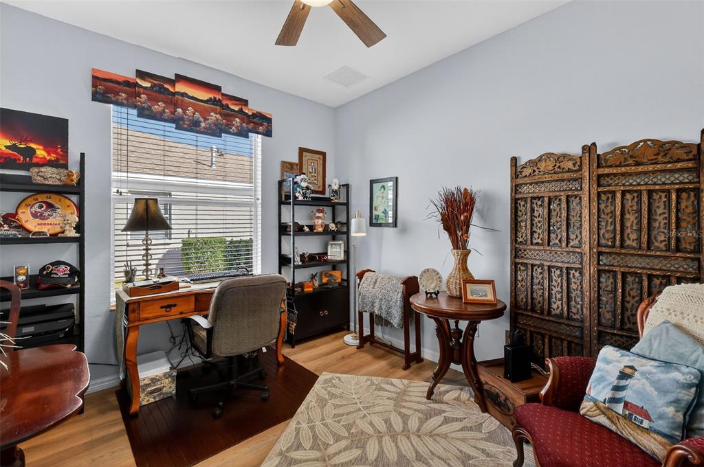 16288 Southwest 14th Avenue Road Ocala, FL 34473 - Photo 22 of 30 a view of a livingroom with workspace and a couch