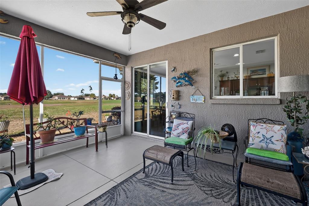 16288 Southwest 14th Avenue Road Ocala, FL 34473 - Photo 23 of 30 a living room with fireplace furniture and a large window