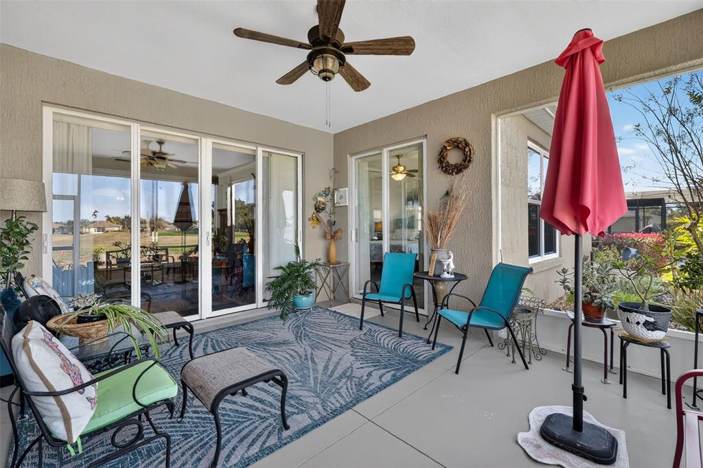 16288 Southwest 14th Avenue Road Ocala, FL 34473 - Photo 24 of 30 a living room with furniture and a potted plant