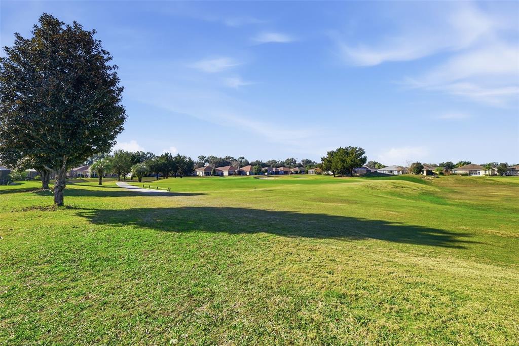 16288 Southwest 14th Avenue Road Ocala, FL 34473 - Photo 25 of 30 a view of a golf course with a lake