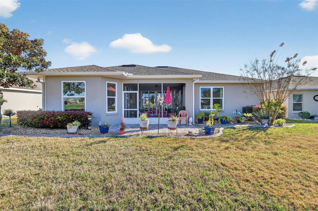 16288 Southwest 14th Avenue Road Ocala, FL 34473 - Photo 28 of 30 a view of a house with patio