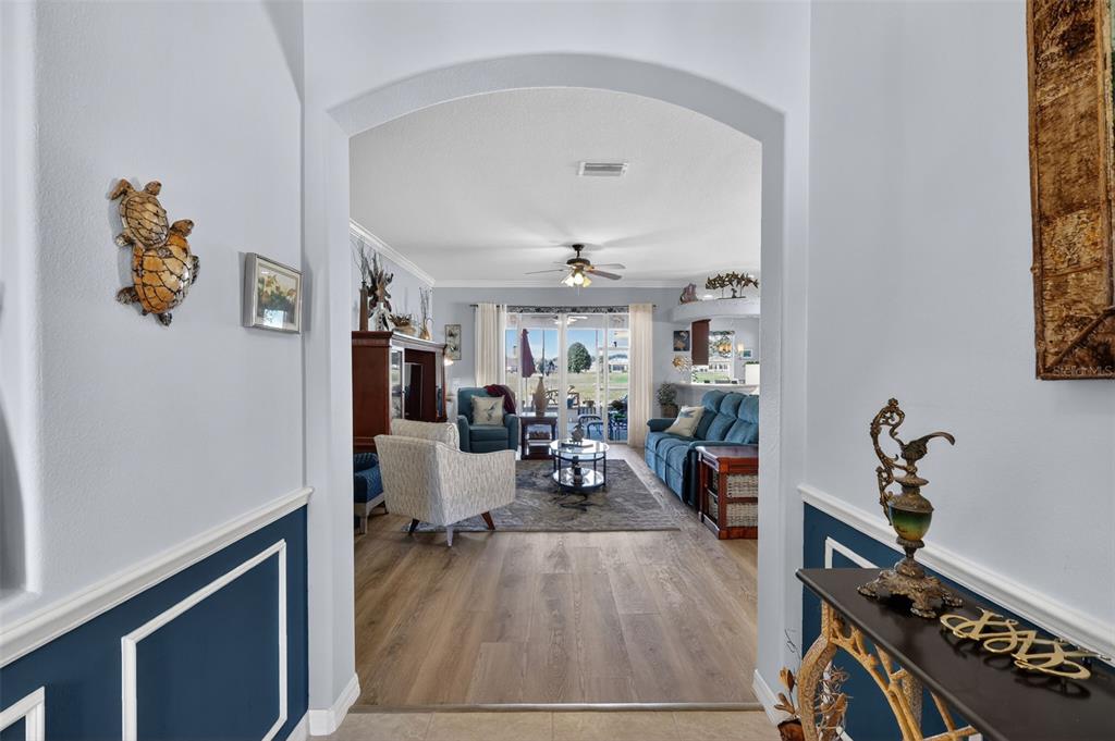 16288 Southwest 14th Avenue Road Ocala, FL 34473 - Photo 3 of 30 a view of a livingroom with furniture and wooden floor
