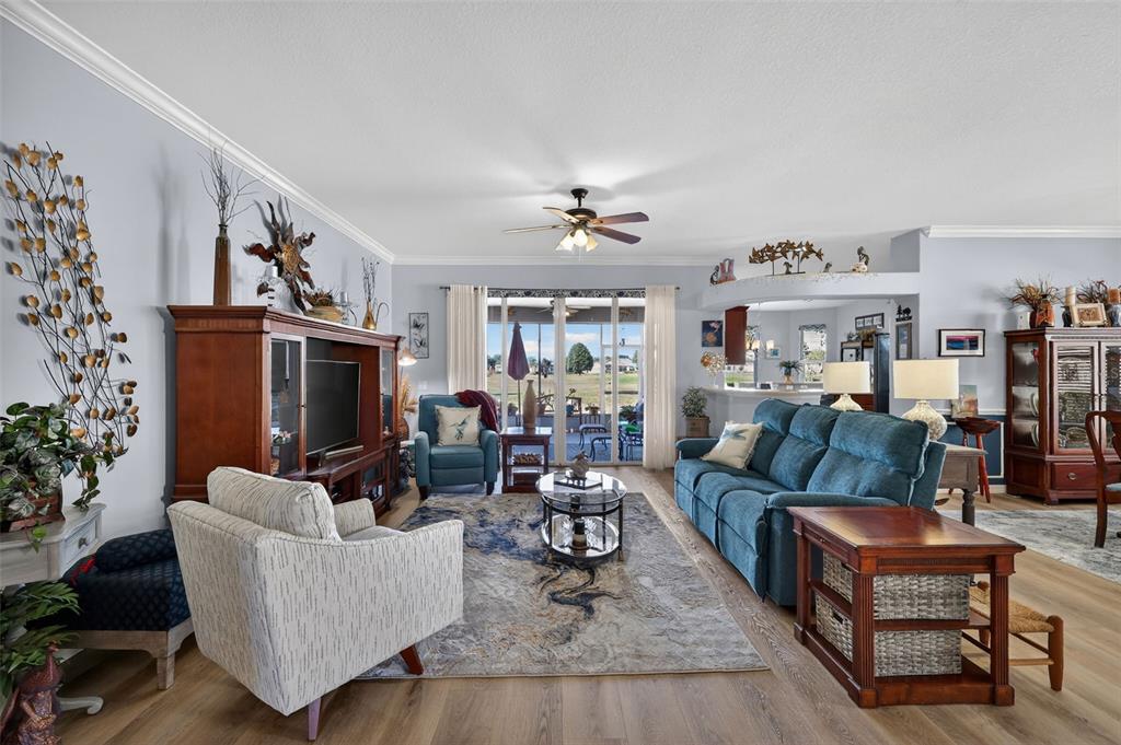 16288 Southwest 14th Avenue Road Ocala, FL 34473 - Photo 4 of 30 a living room with furniture a fireplace and a flat screen tv