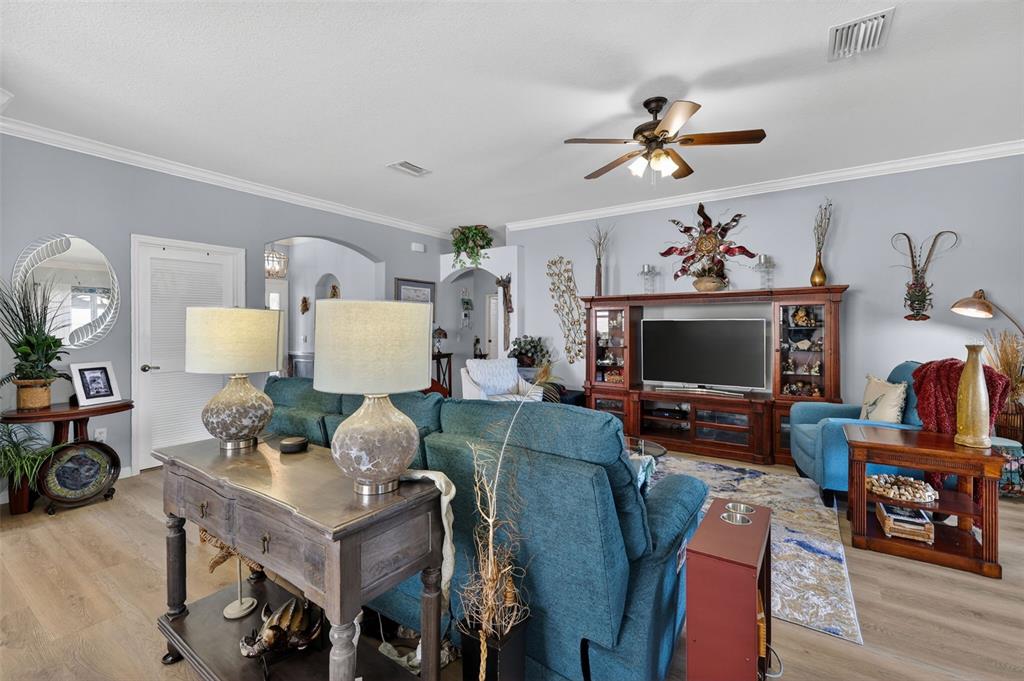 16288 Southwest 14th Avenue Road Ocala, FL 34473 - Photo 7 of 30 a living room with furniture and a flat screen tv