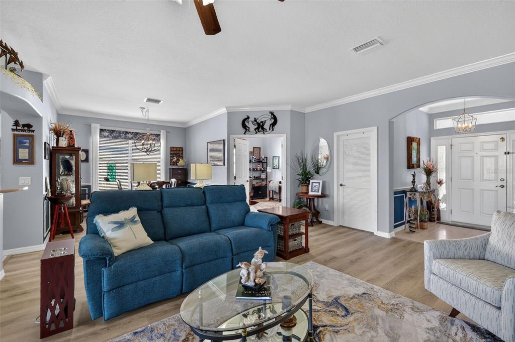 16288 Southwest 14th Avenue Road Ocala, FL 34473 - Photo 9 of 30 a living room with furniture and a wooden floor
