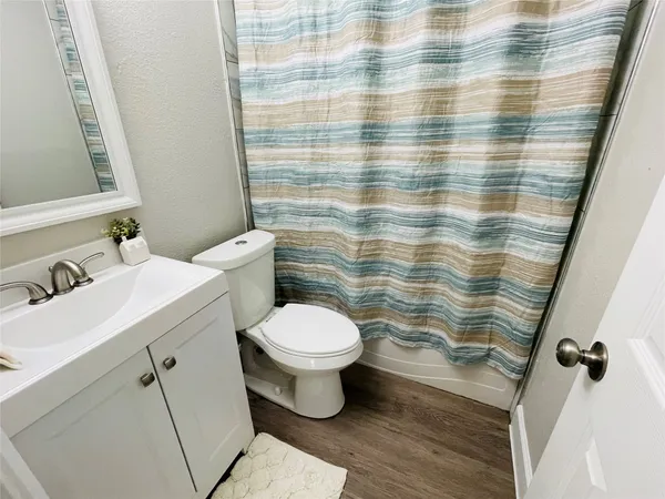 a bathroom with a sink and toilet