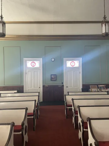 a room with a table and chairs